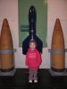 jessica in front of projectiles and rocket.jpg