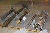 From left a French half-size T-10 training rocket, a full size T-10 rocket, two 68 mm rockets an.jpg From left a French half-size T-10 training rocket, a full size T-10 rocket, two 68 mm rockets an.jpg