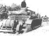 A Panzer IV tows a trailer with a couple of petrol drums.jpg