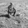 5 A German prisoner engaged in clearing a minefield near Stavanger fixes a fuse to a Teller mine.jpg