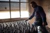 A man brings together hand-made missiles in a secret rebel factory in Al-Bab.jpg