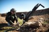 Syrian rebels prepare missiles for launch near the Abu Baker brigade in Albab.jpg