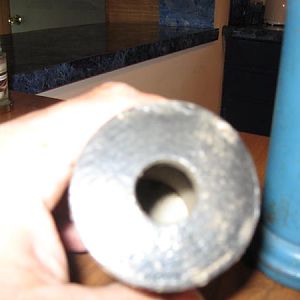 Hole in bottom of projectile for spotting charge.
