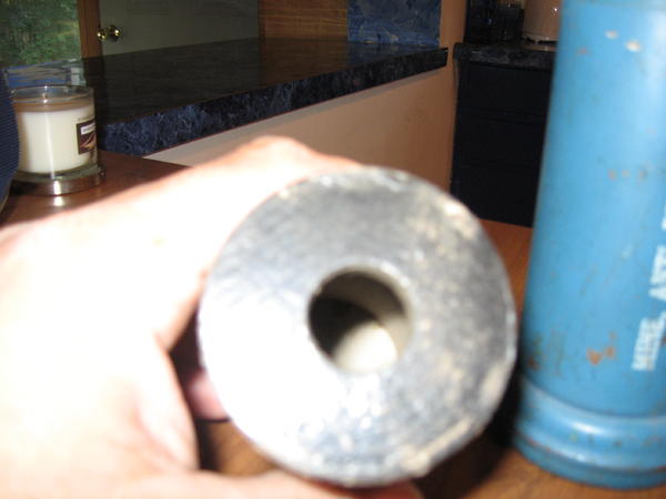 Hole in bottom of projectile for spotting charge.